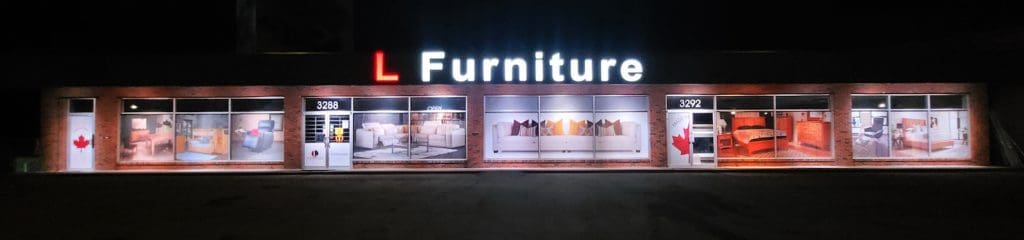 L Furniture storefront night time